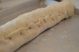 If your dough isn't sealing to the outside to create a seal, use toothpicks to "sew" it shut.  