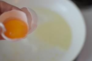 Crack egg & separate the yolk from the egg white. 